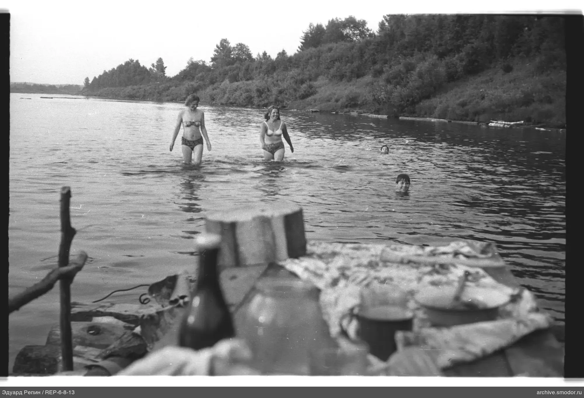 People in the river with table in foreground