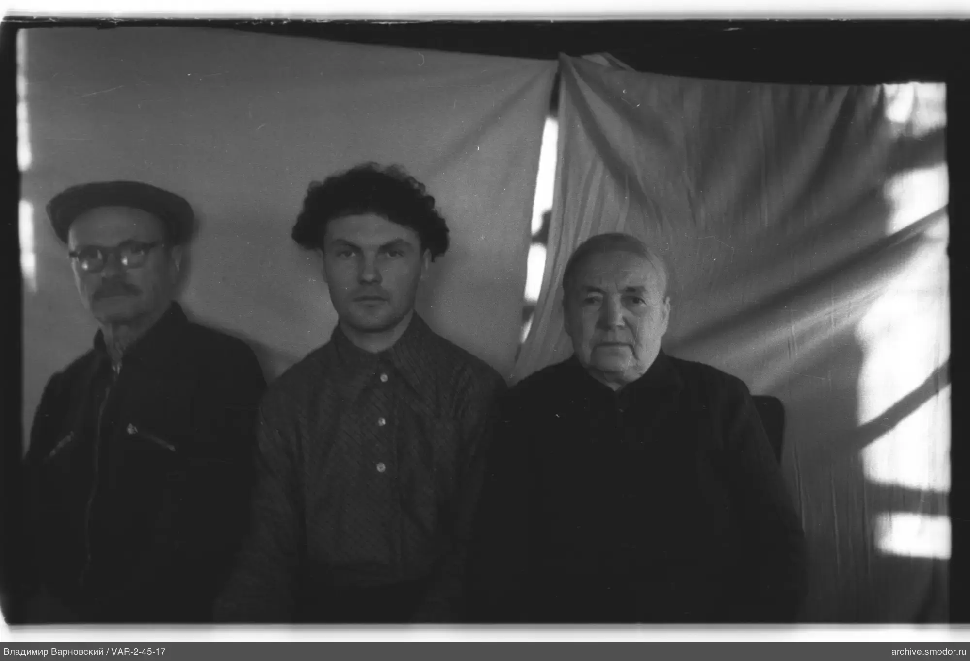 Group portrait of three men
