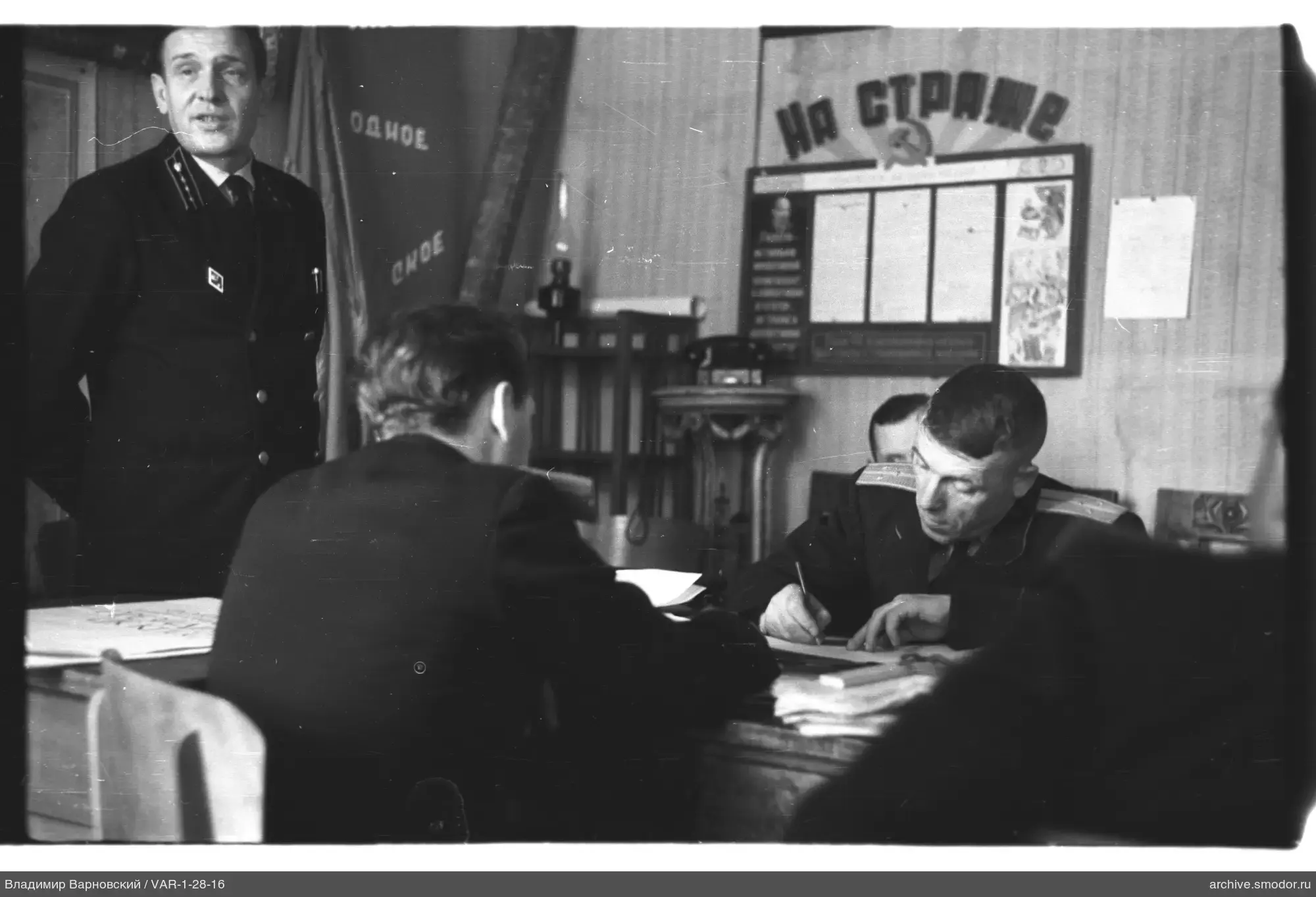 Men in military uniforms at a table