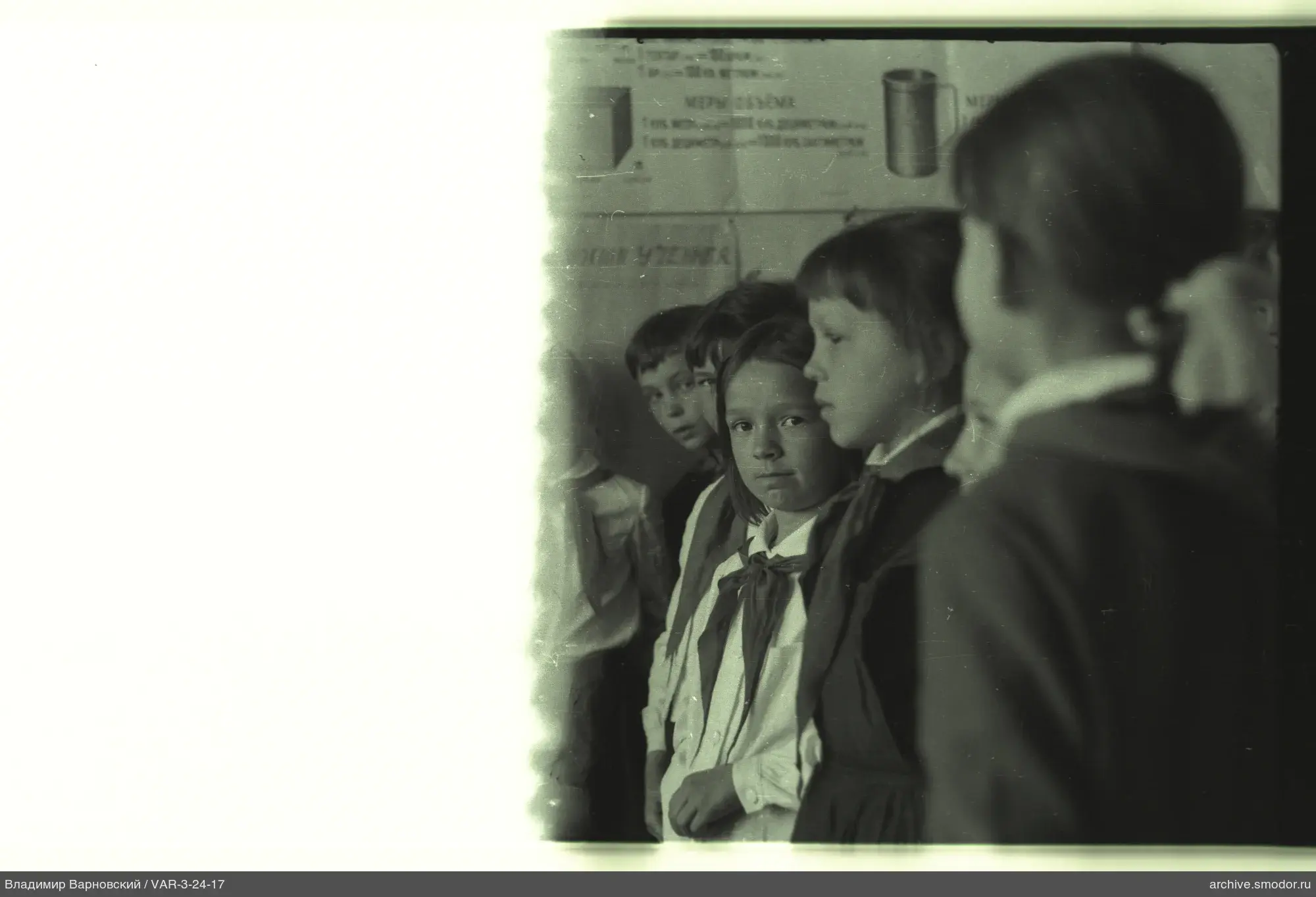 Group portrait of children with poster