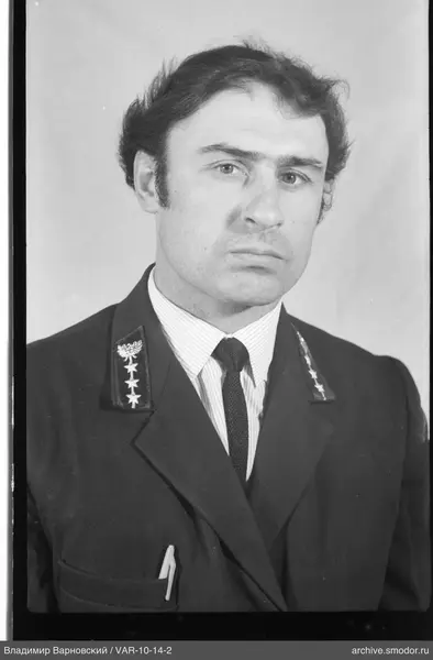 Portrait of a man in a jacket with emblems