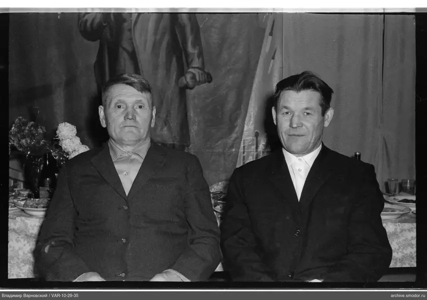 Two men in group portrait