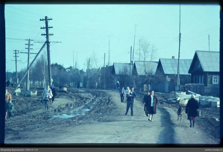 Street with wooden houses and power lines