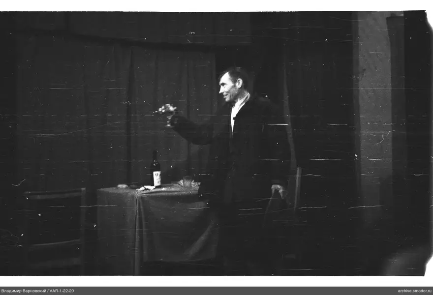 Man with a glass at the table