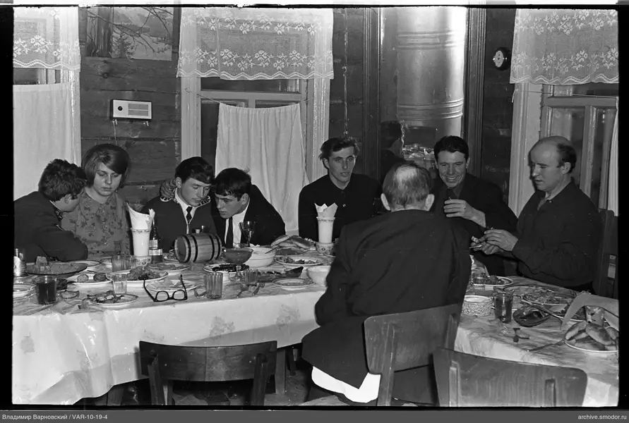 Group sitting at a table in a room