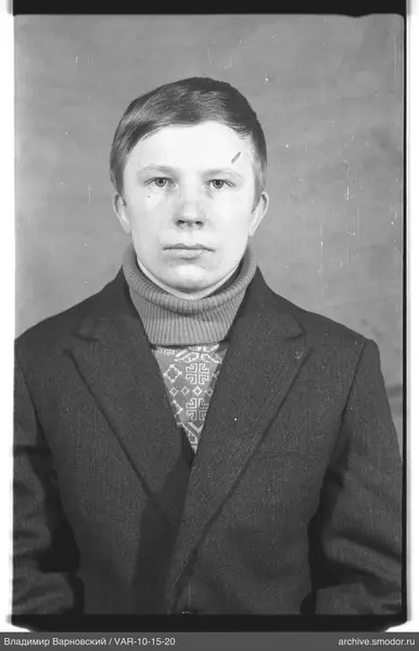 Portrait of a man with short light hair