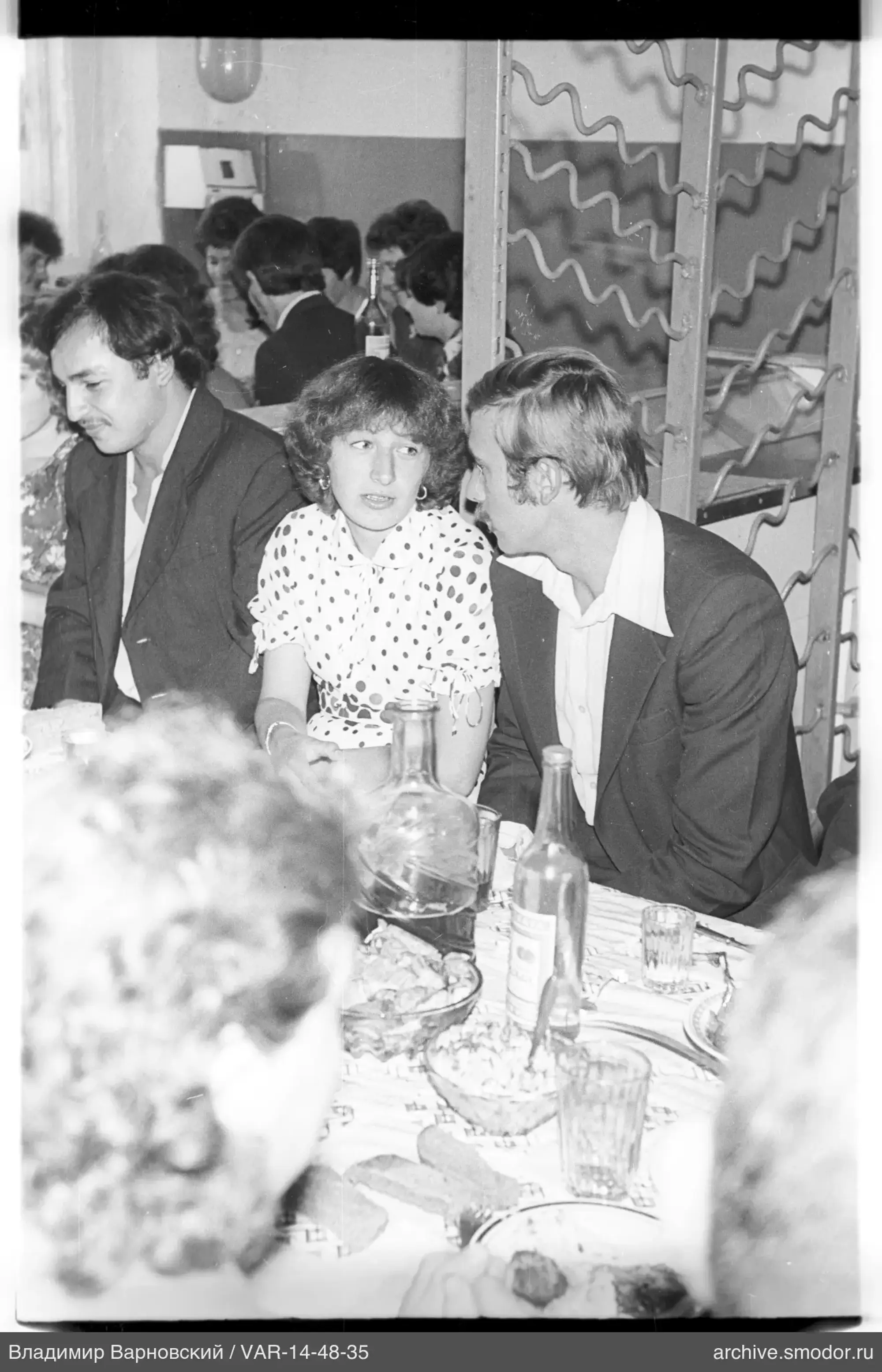 People sitting at a table during an event