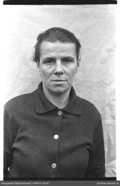 Portrait of a woman in a dark cardigan