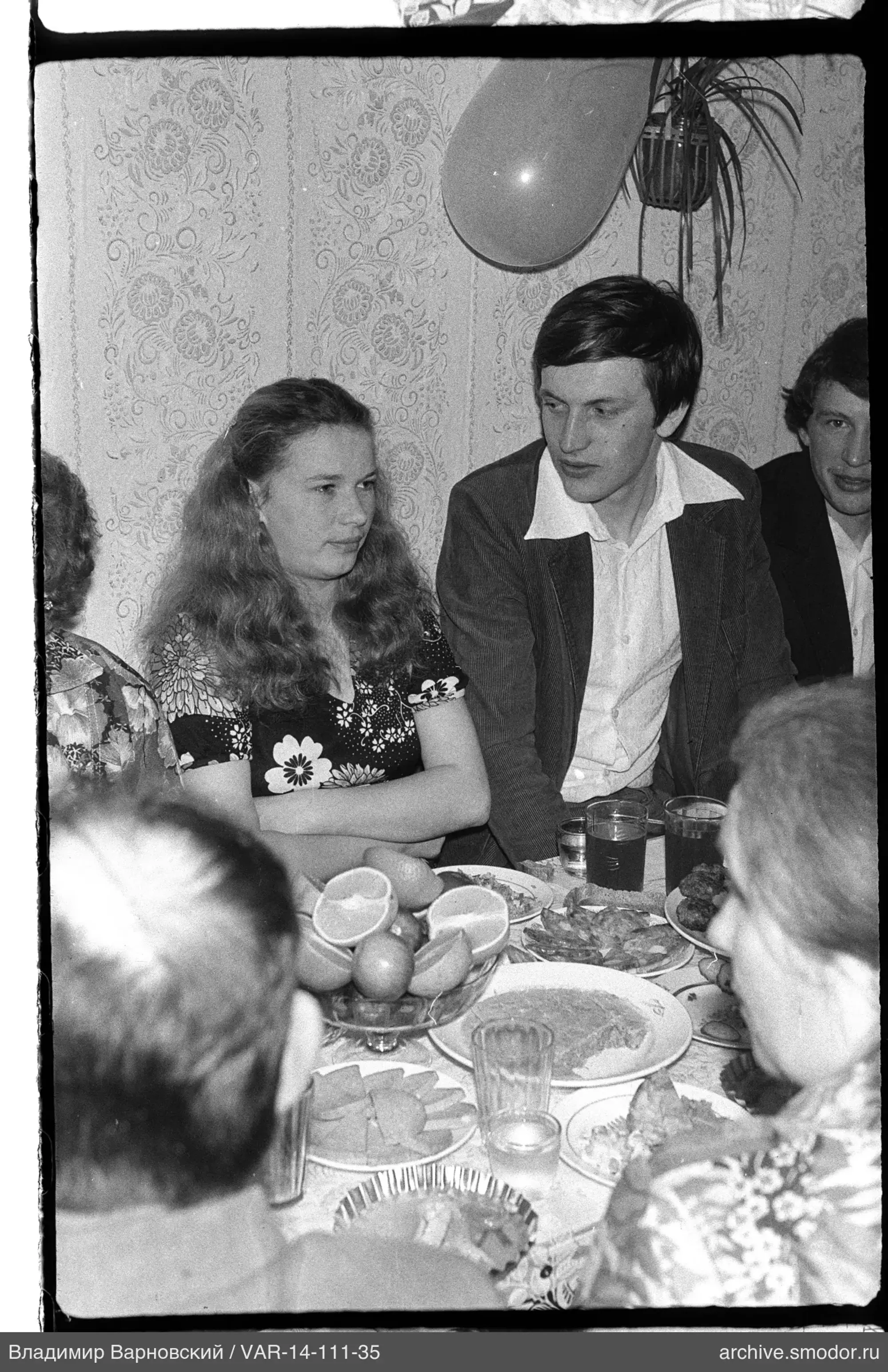 People sitting at a table during an event