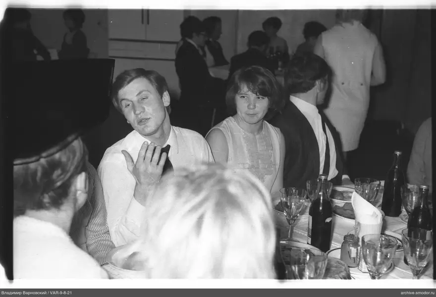 People sitting at a table at an event