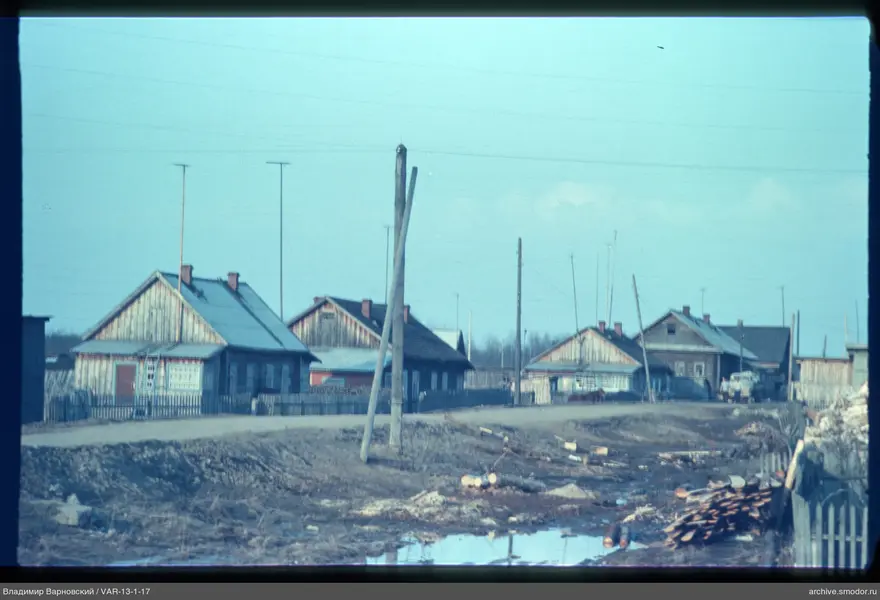 Wooden houses along a dirt road
