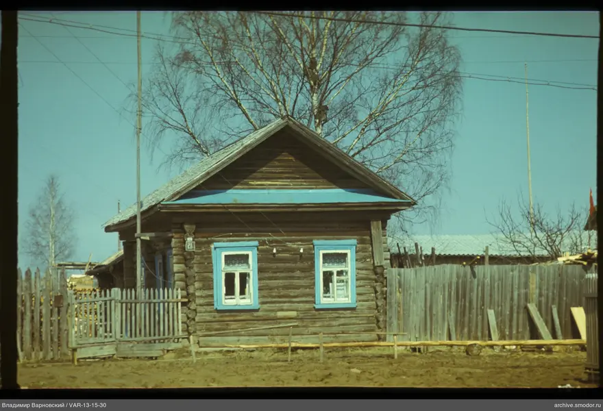 Wooden house with blue-trimmed windows