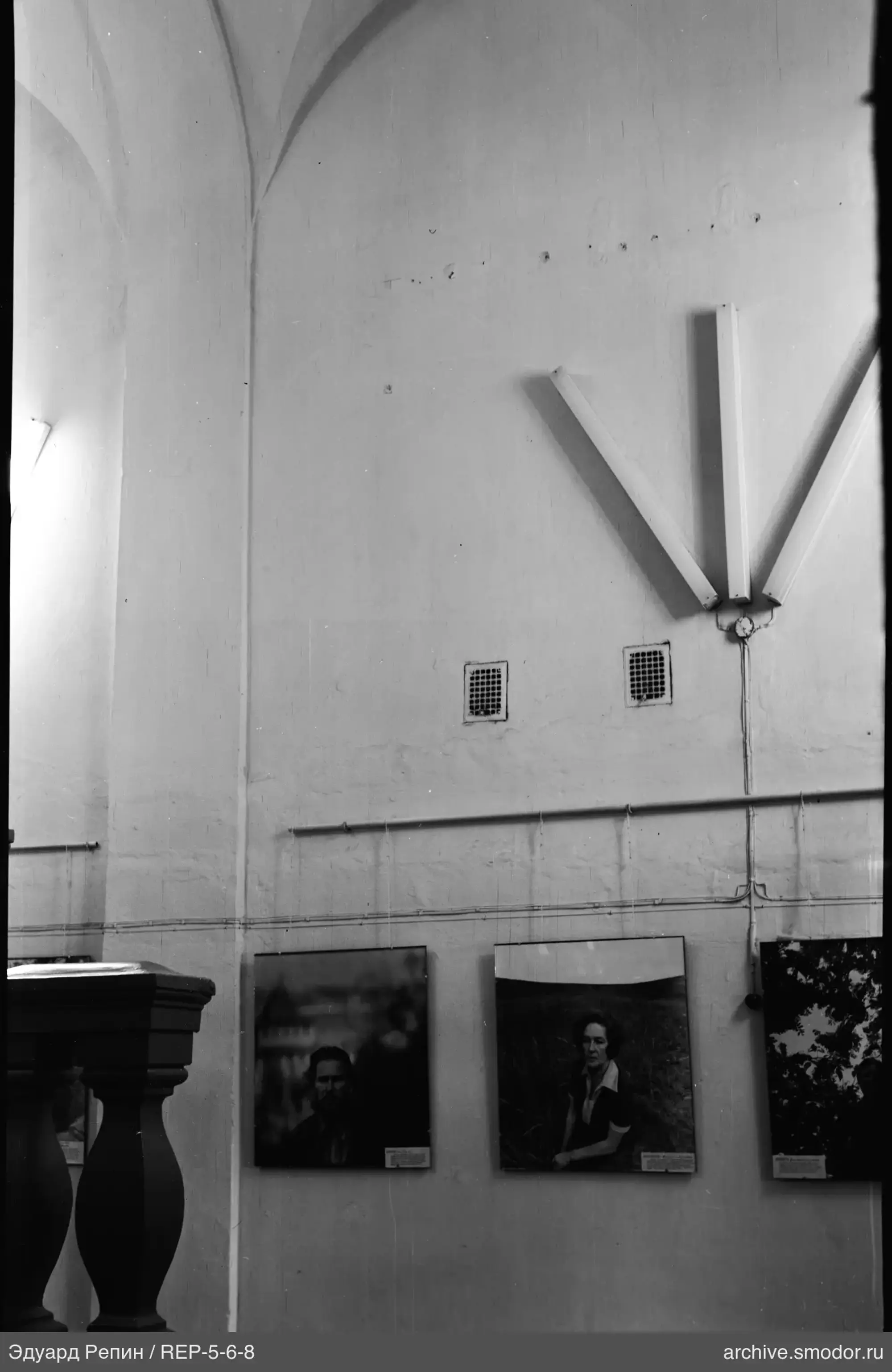 Interior with vaulted ceilings and photographs
