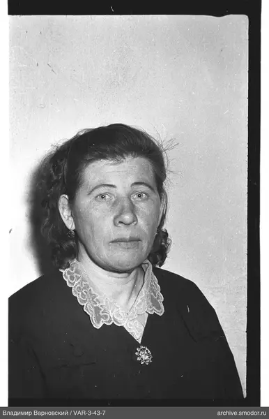 Portrait of a woman in a dark dress