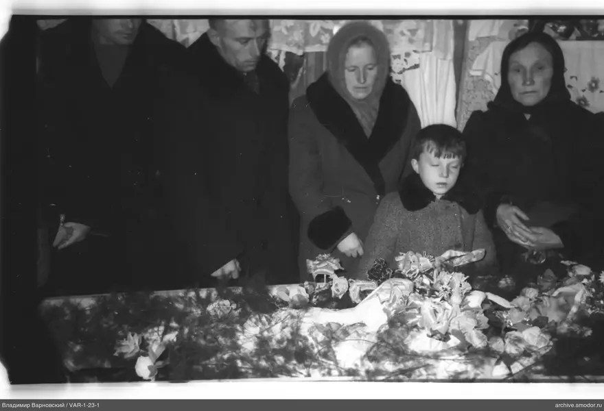 Group of people behind a table with flowers