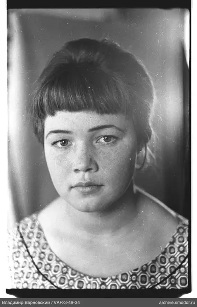 Bust portrait of a woman with short bangs