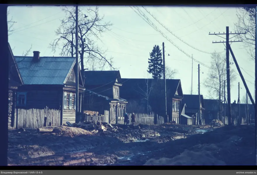 Wooden houses and women on the street