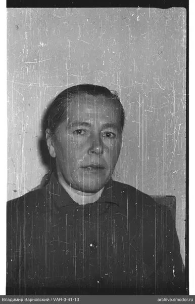 Bust portrait of a woman with combed back hair