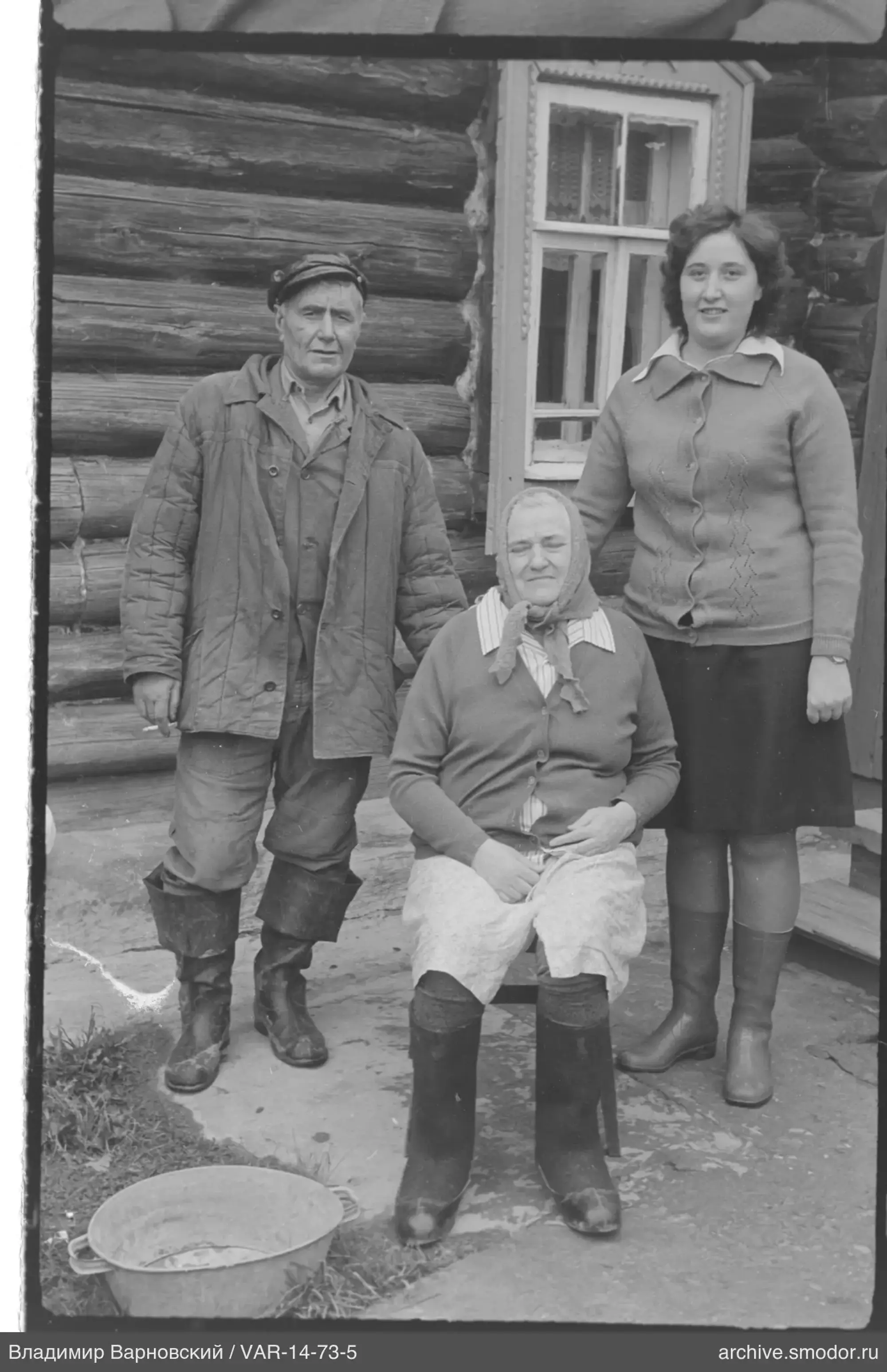 Group portrait with house and metal bowl