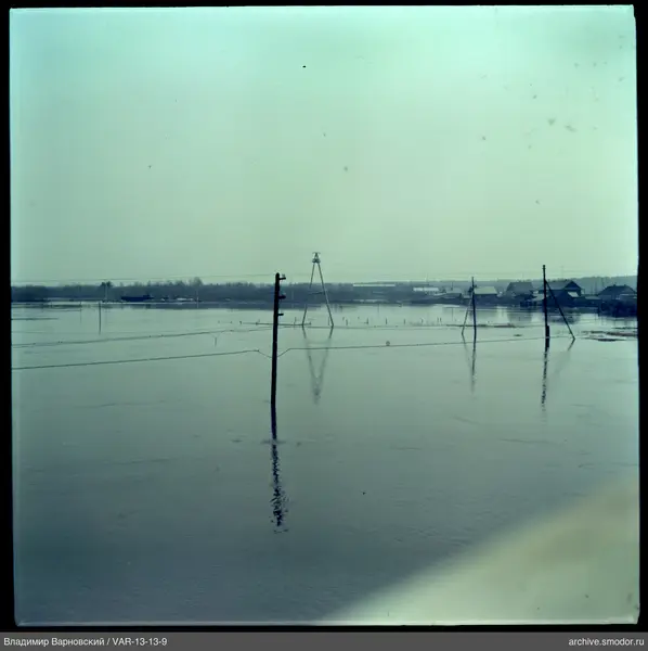 Flooded area with poles and houses