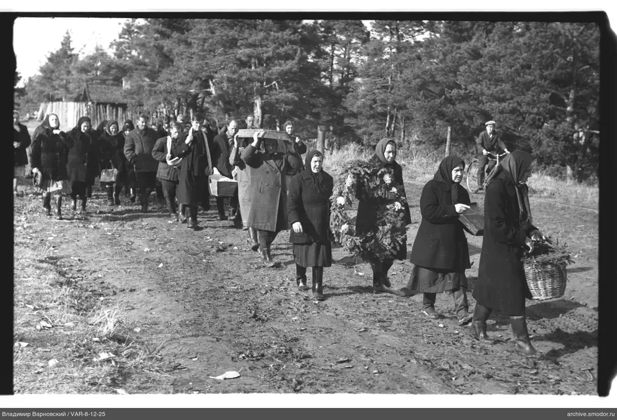 Group of people walking along a dirt road