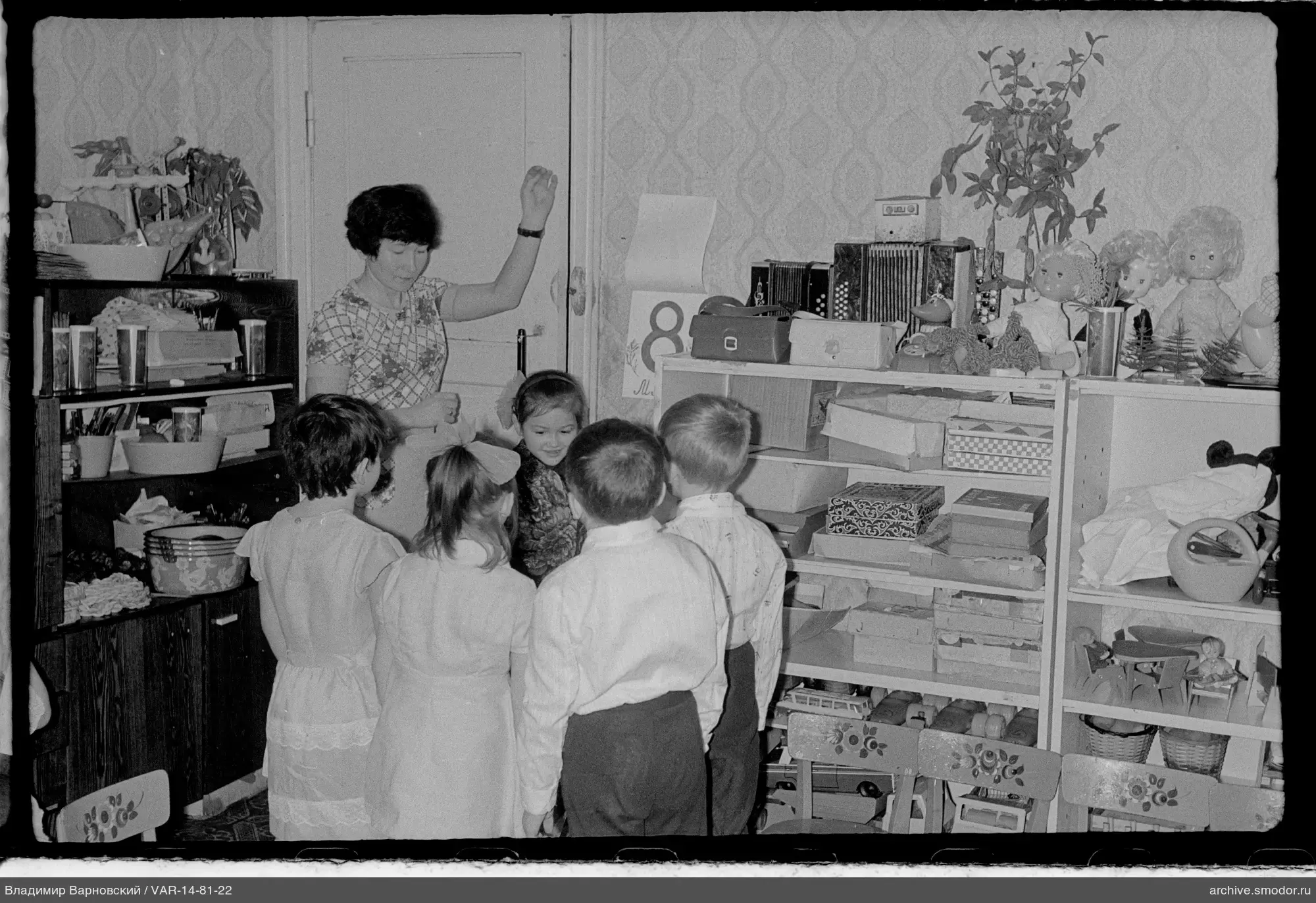 Woman with children by the door