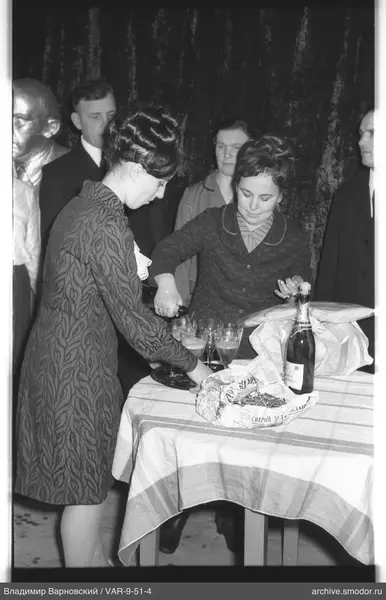 Woman pouring drink at event