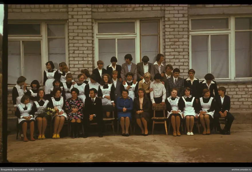 Group portrait in front of a brick building