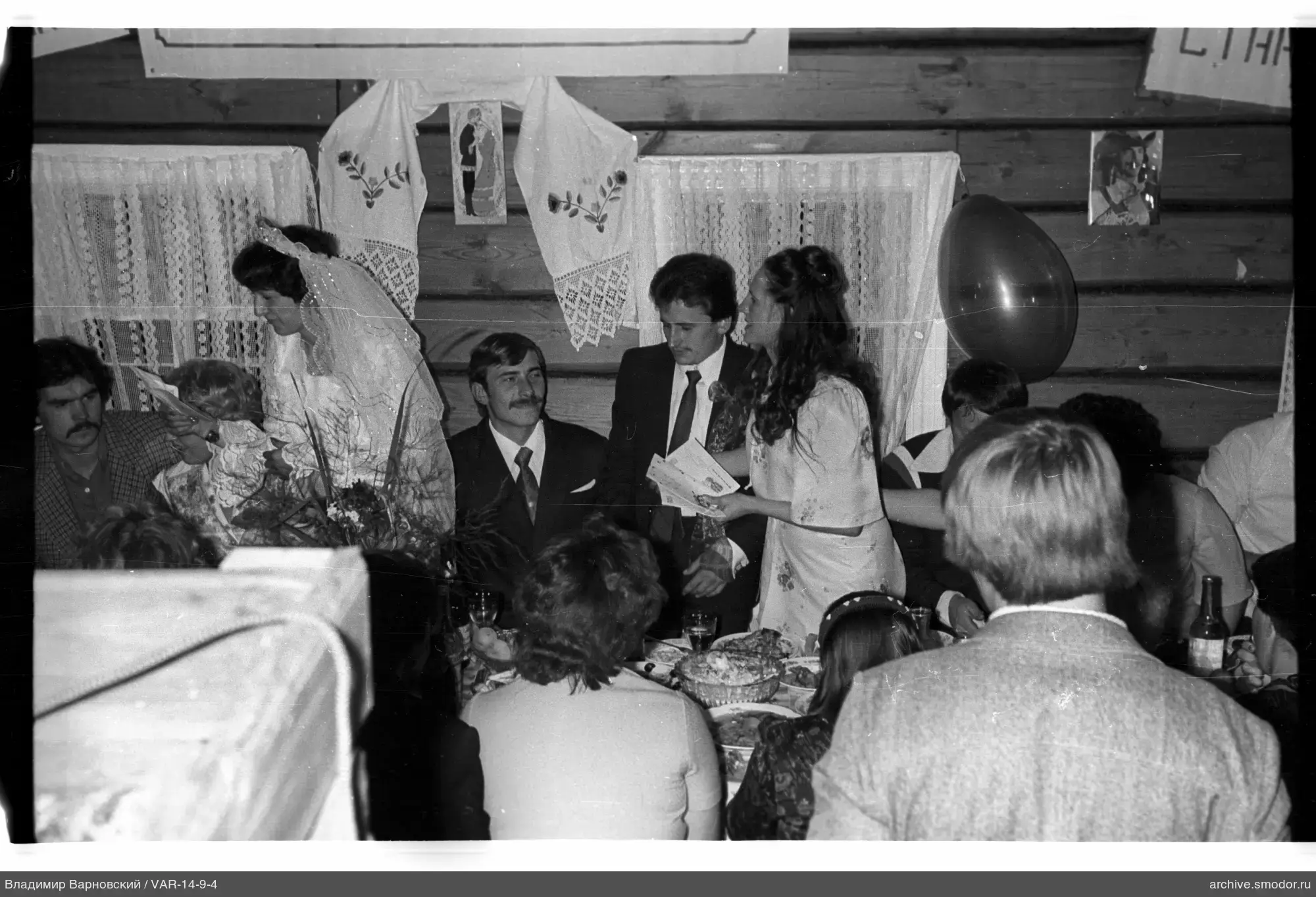 Group at a table in a wooden room