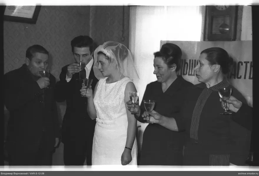 Group portrait of five people with drinks
