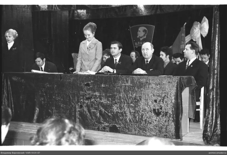 People sitting at a table at an event