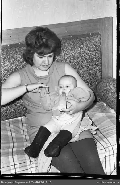Woman with child on bed