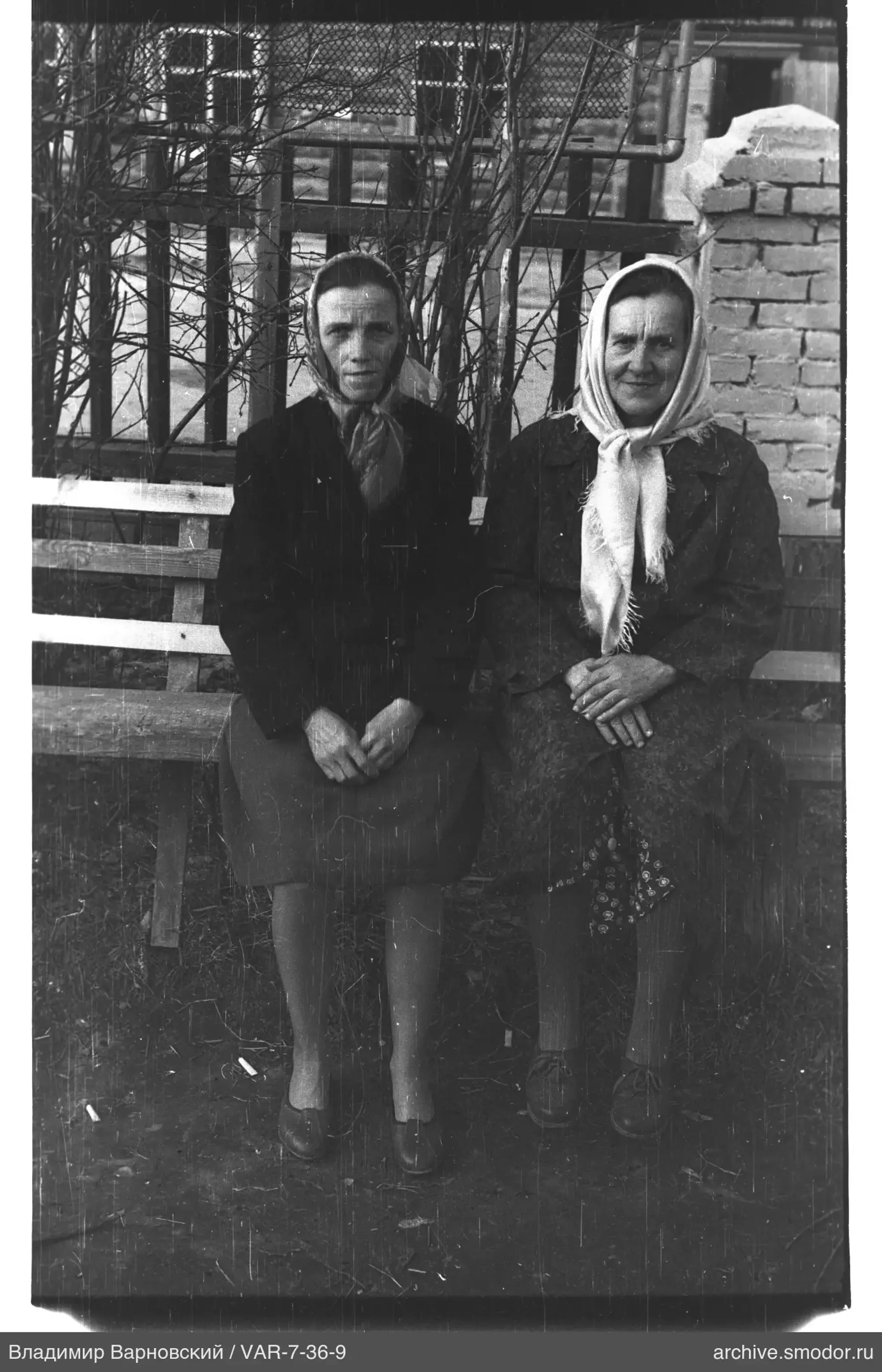 Two women sitting outdoors