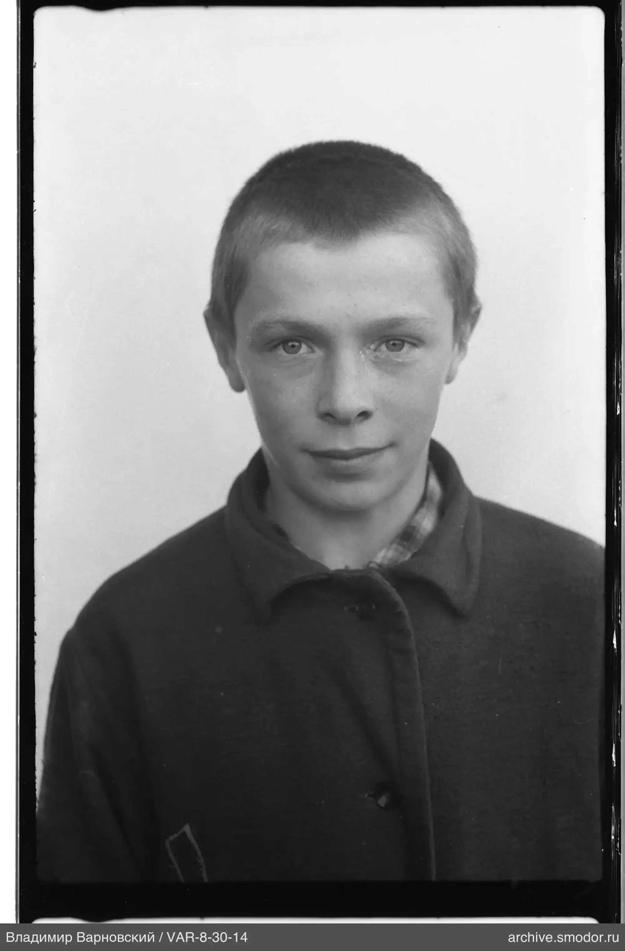 Boy's portrait in dark coat