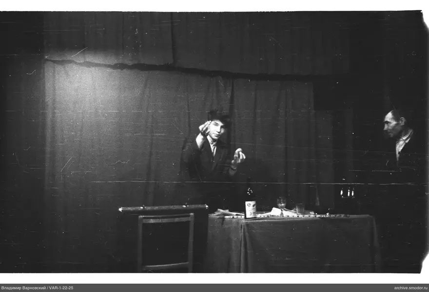 Two men in suits at a table