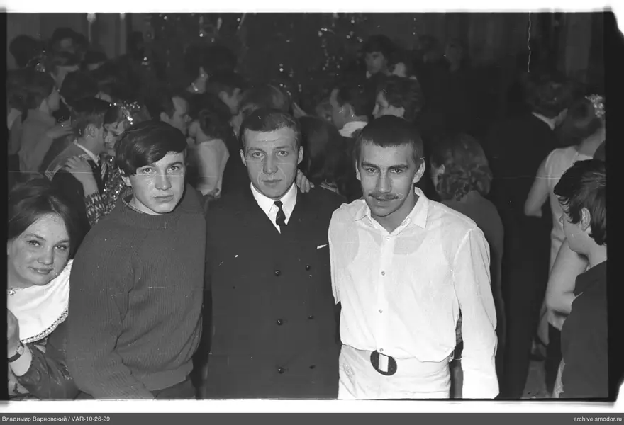Group portrait with dancers in background