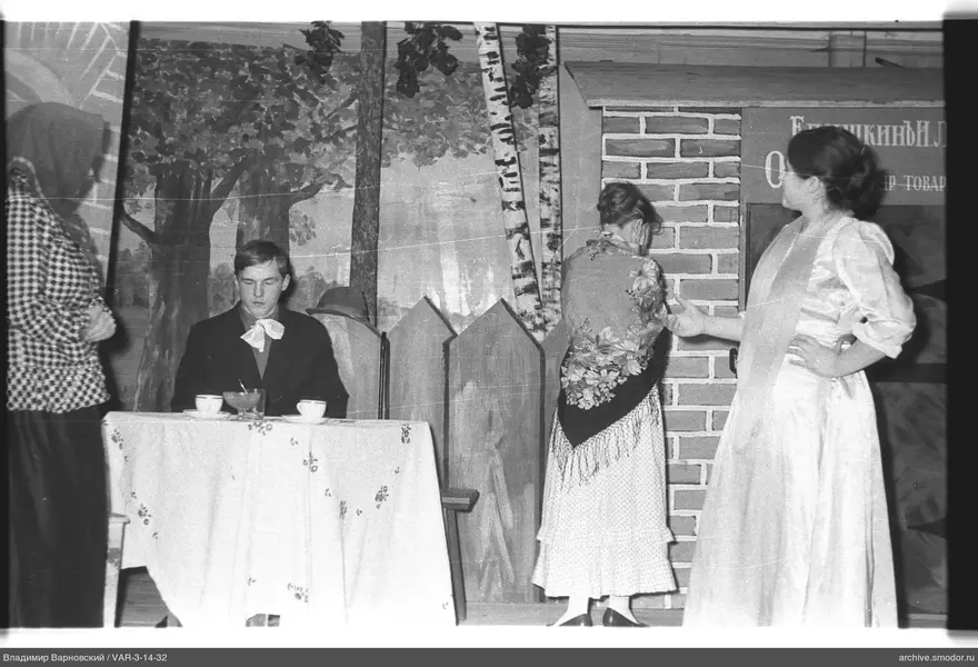 Four people on stage with decoration