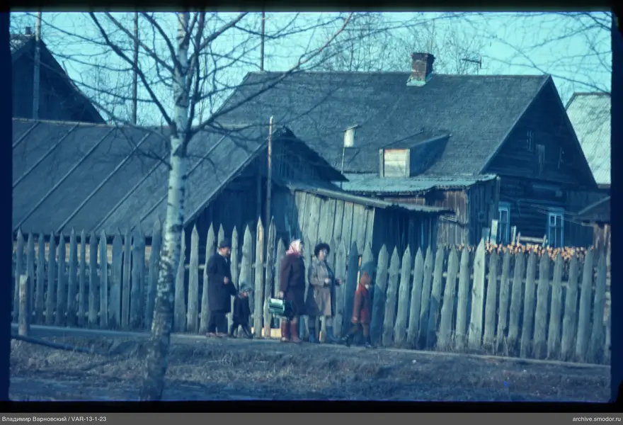 Five people walking along a path