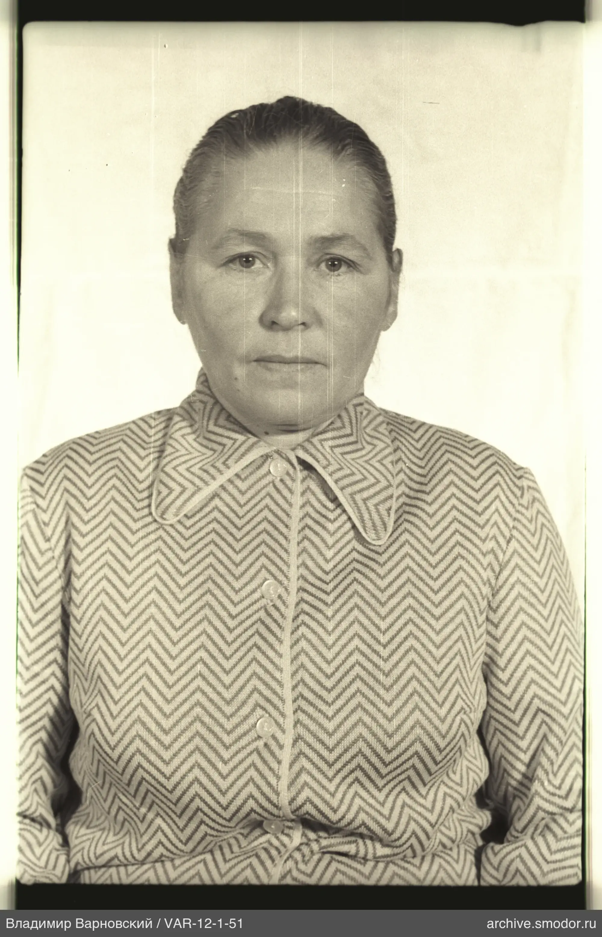 Portrait of a woman with a patterned blouse