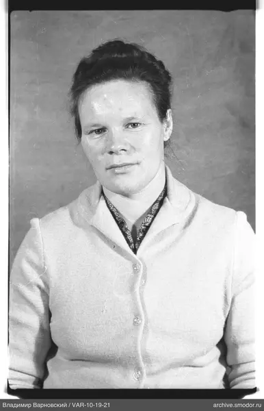 Portrait of a woman with scarf and cardigan