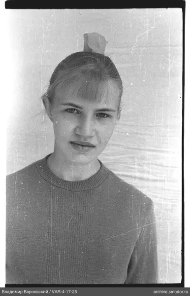 Portrait of a woman with hairstyle and light sweater
