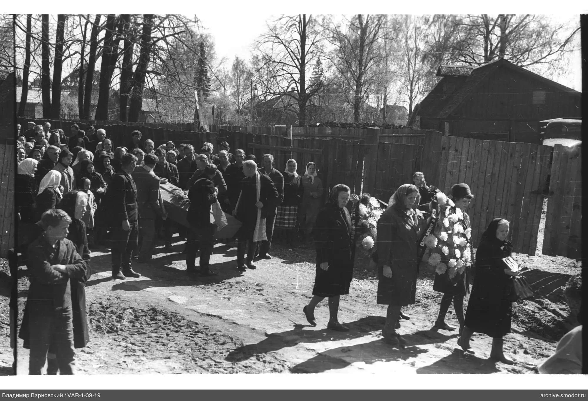 Funeral procession with wreaths and coffin