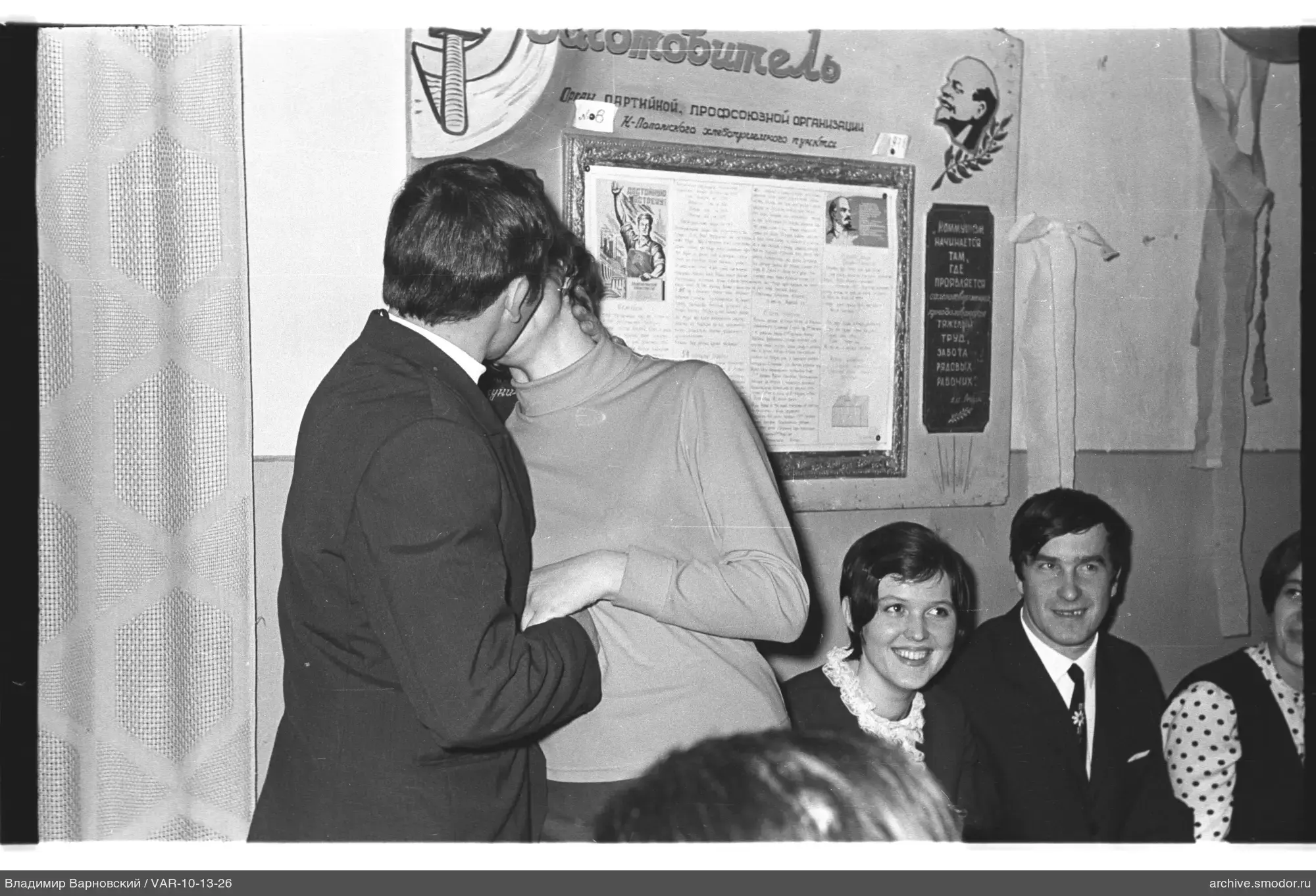 Man kissing woman at event
