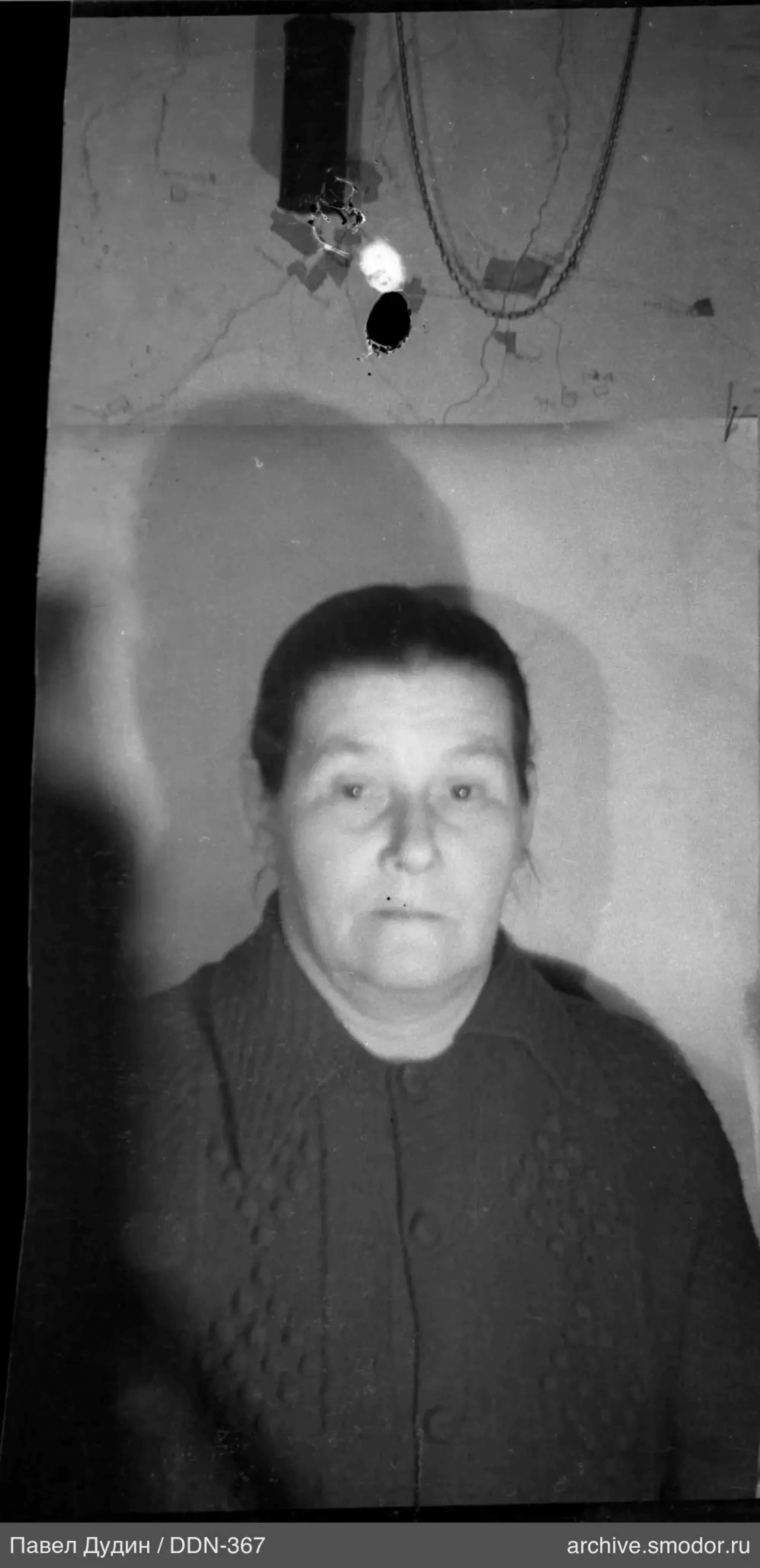 Portrait of a woman in a dark cardigan