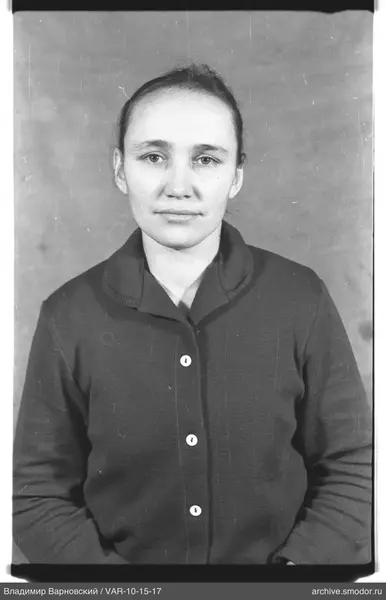 Portrait of a woman in a dark cardigan