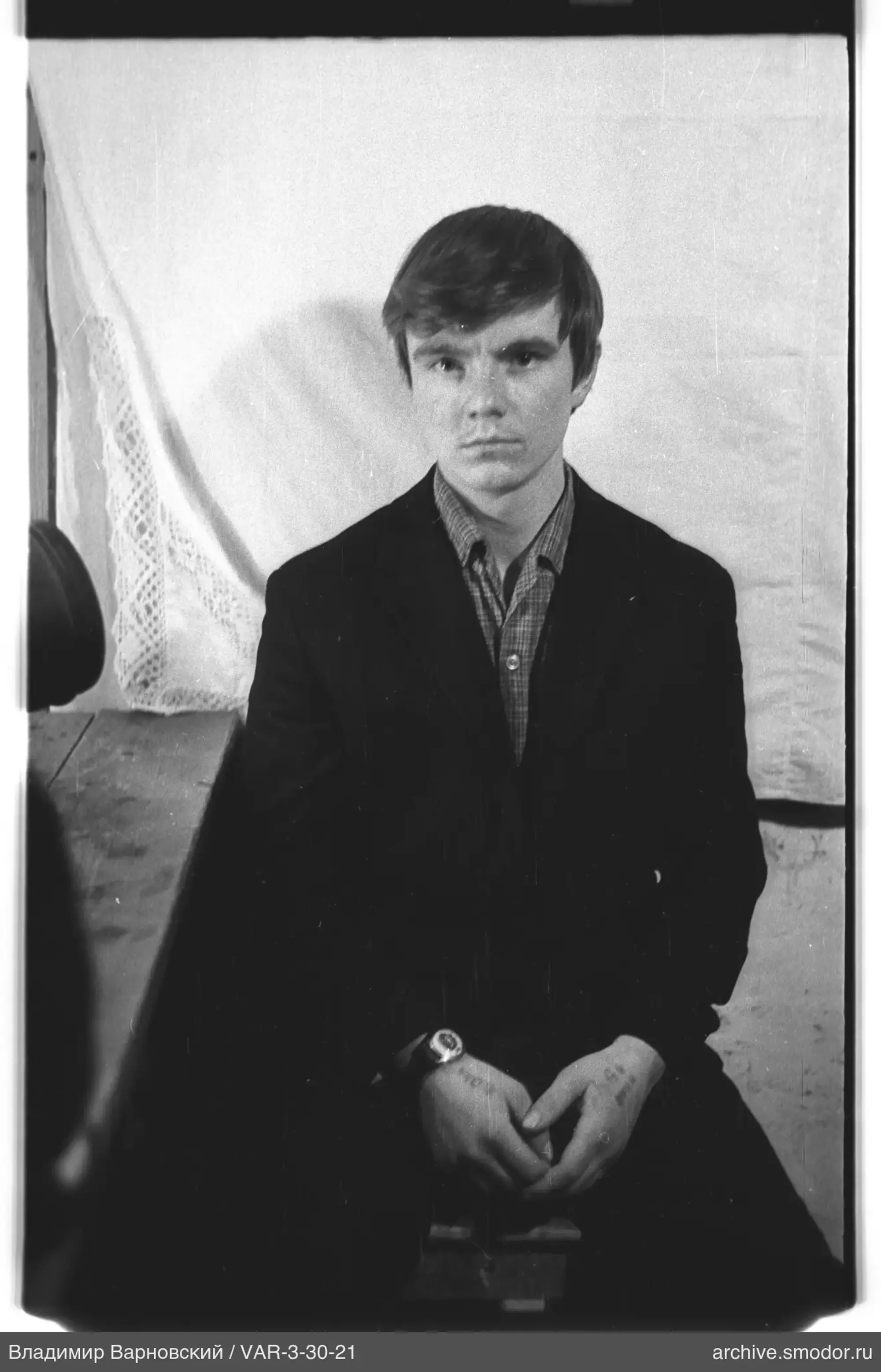 Young man sitting on a bench