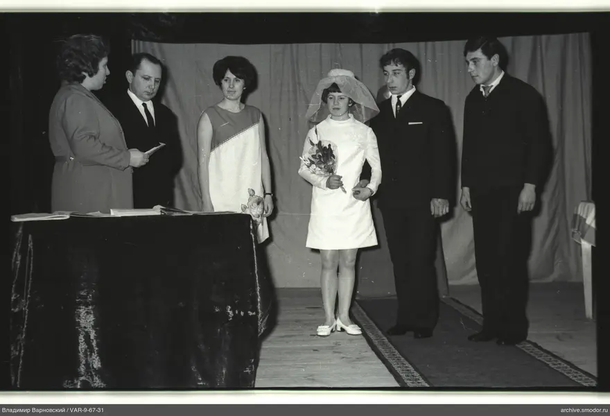 Group on stage with curtain