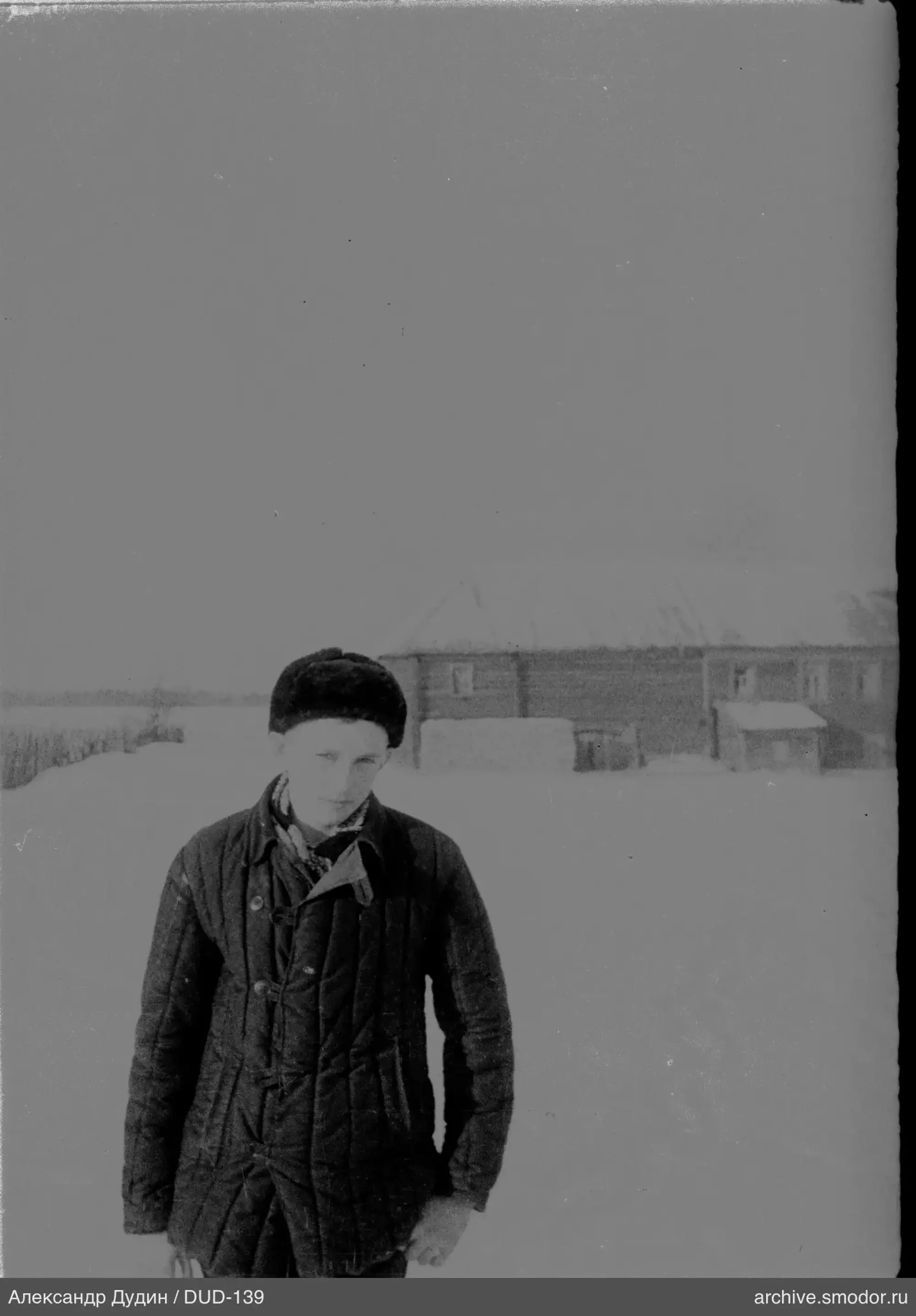Man in ushanka hat on snow