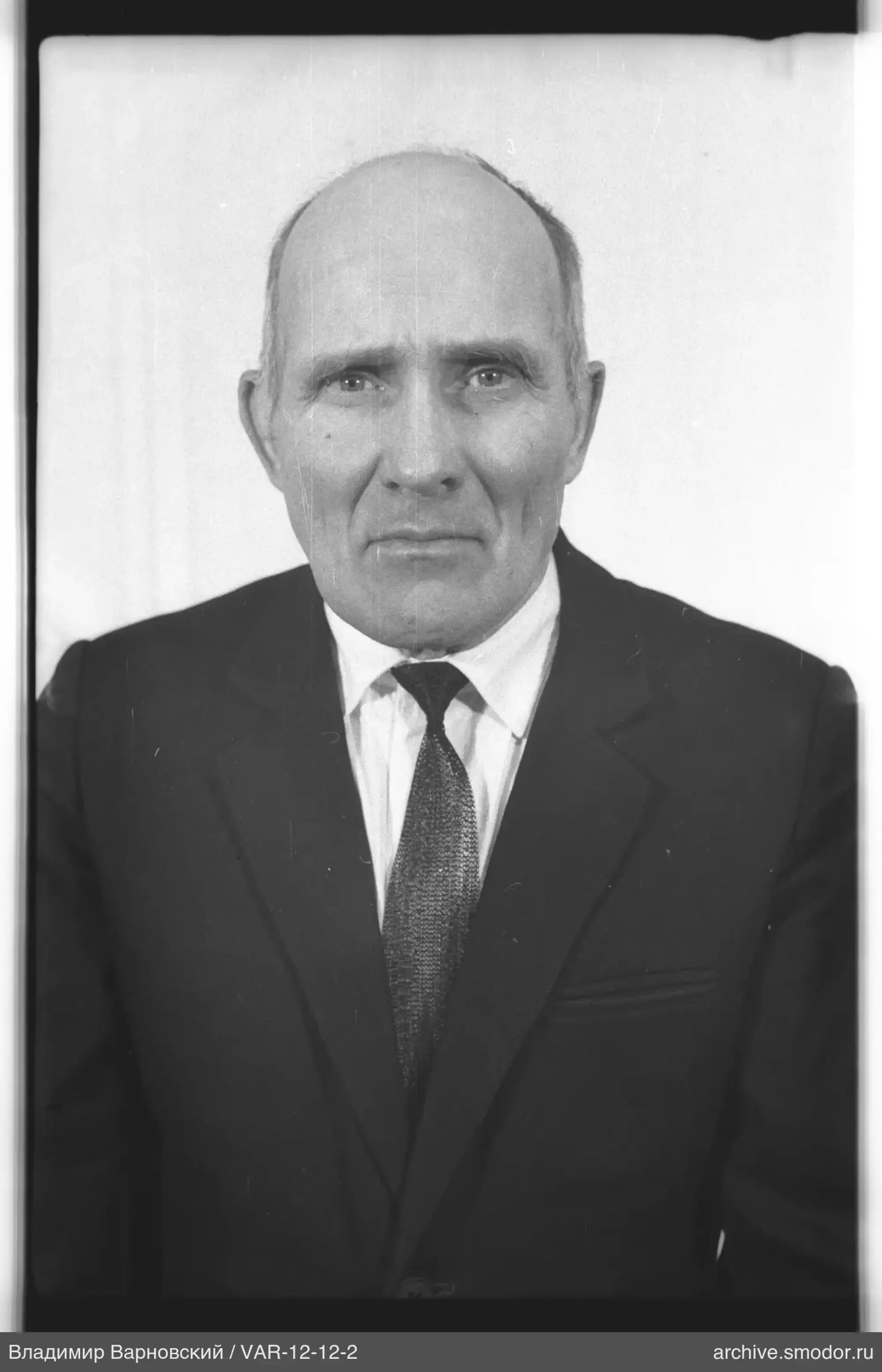 Full-length portrait of a man in a suit