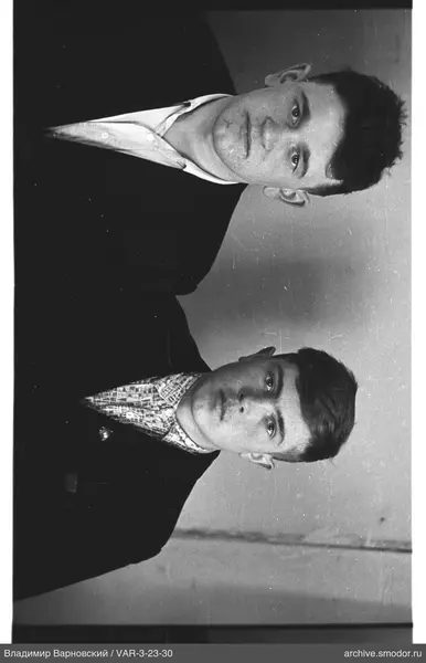 Two young men in jackets and shirts